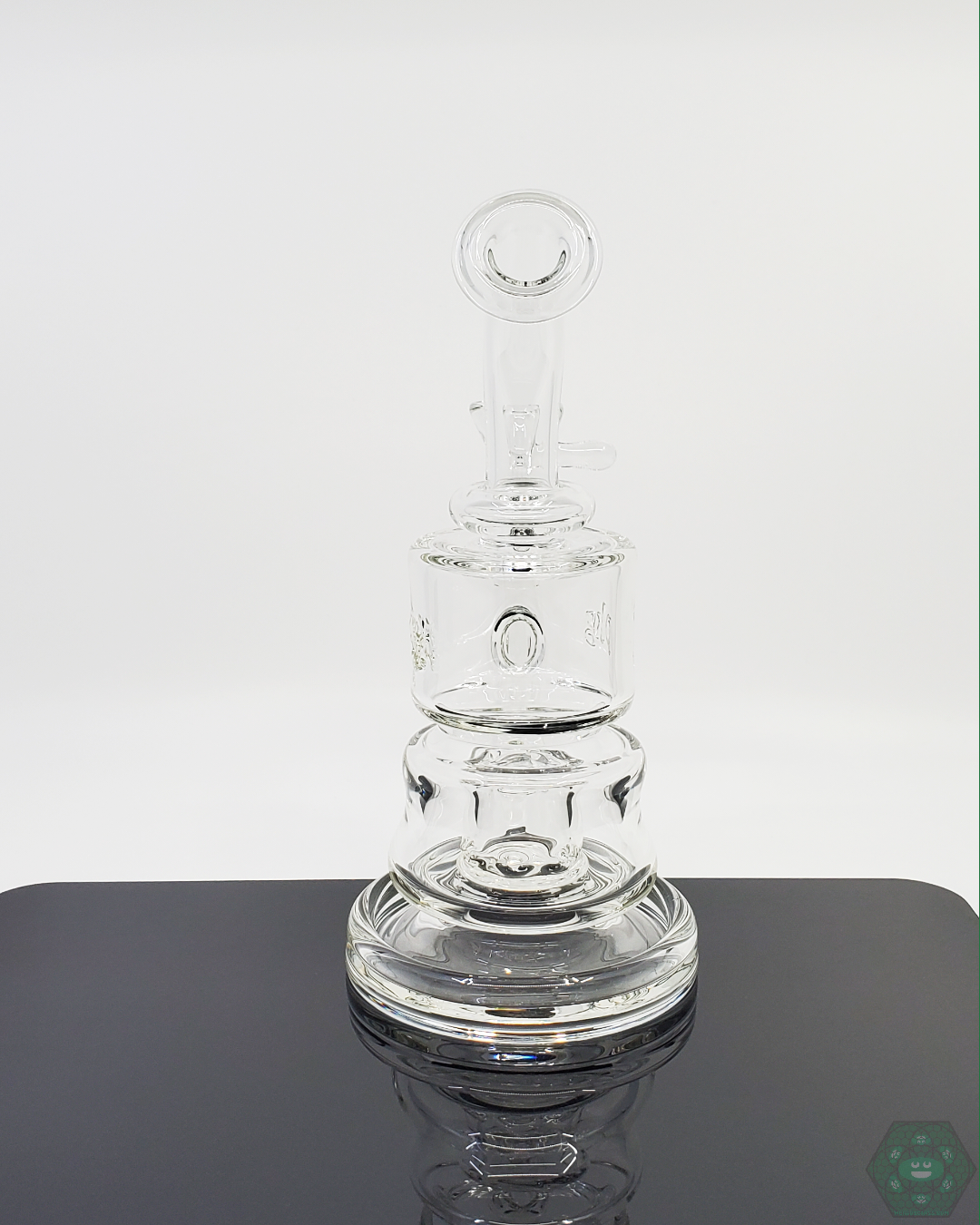 Durable PKG 60mm Puck Rig made from high-quality glass, featuring a stable base and superior airflow for seasoned concentrate users