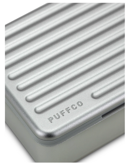 Puffco Pivot Travel Case – Compact storage for Pivot, Hot Knife, and accessories, featuring an aluminum exterior and soft silicone lining.