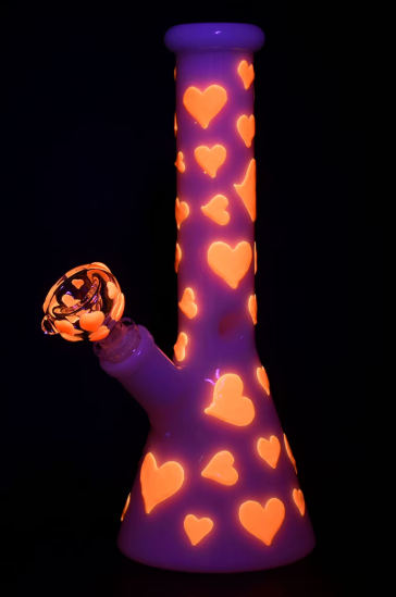 Pulsar Valentine's Day Heart Beaker Water Pipe with 3-pinch ice catcher, glow-in-the-dark accents, and 14mm male herb slide.