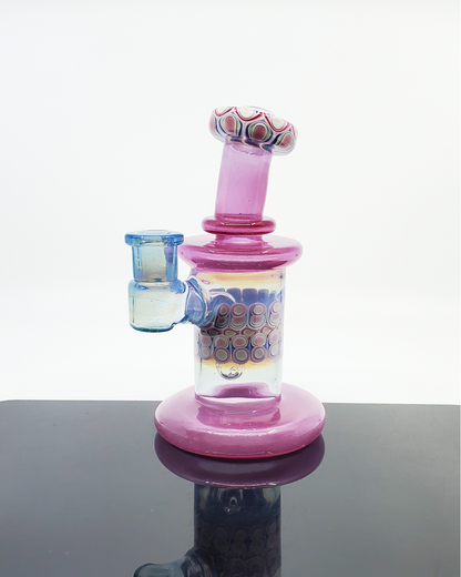 RL Dots Dotstack Jammer, an innovative dab rig featuring RL Dots' signature dotstack design and a unique mouth chamber that enhances airflow for smooth pulls, a stylish and exceptional addition to any glass collection.
