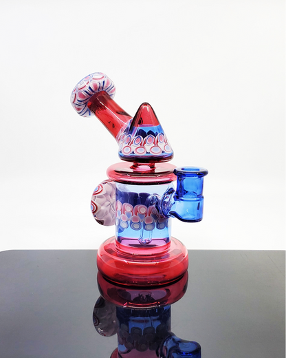 RL Dots Kickback Jammer Details: Close-up showcasing the unique dot stack marble accent, 3-hole perc, and 90-degree joint of this 14mm dab rig, highlighting its design and functionality.