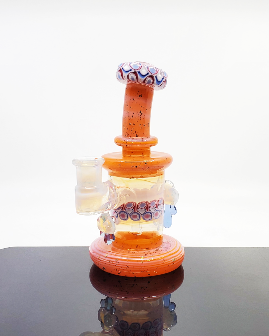 RL Dots x Zombri Cloud Jammer Collab, a limited-edition heady glass rig blending RL Dots and Zombri's artistry in a cloud-themed design, compact size and intricate design ideal for collectors looking for distinctive, collaborative glass.


