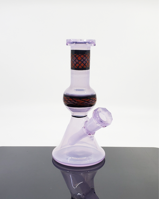 Shipley Glass Lilac Faceted Jammer, a beautiful 10mm dab rig in a lilac hue with a faceted design, blending function and artistry, ideal for those who value both aesthetic and performance in their glassware.