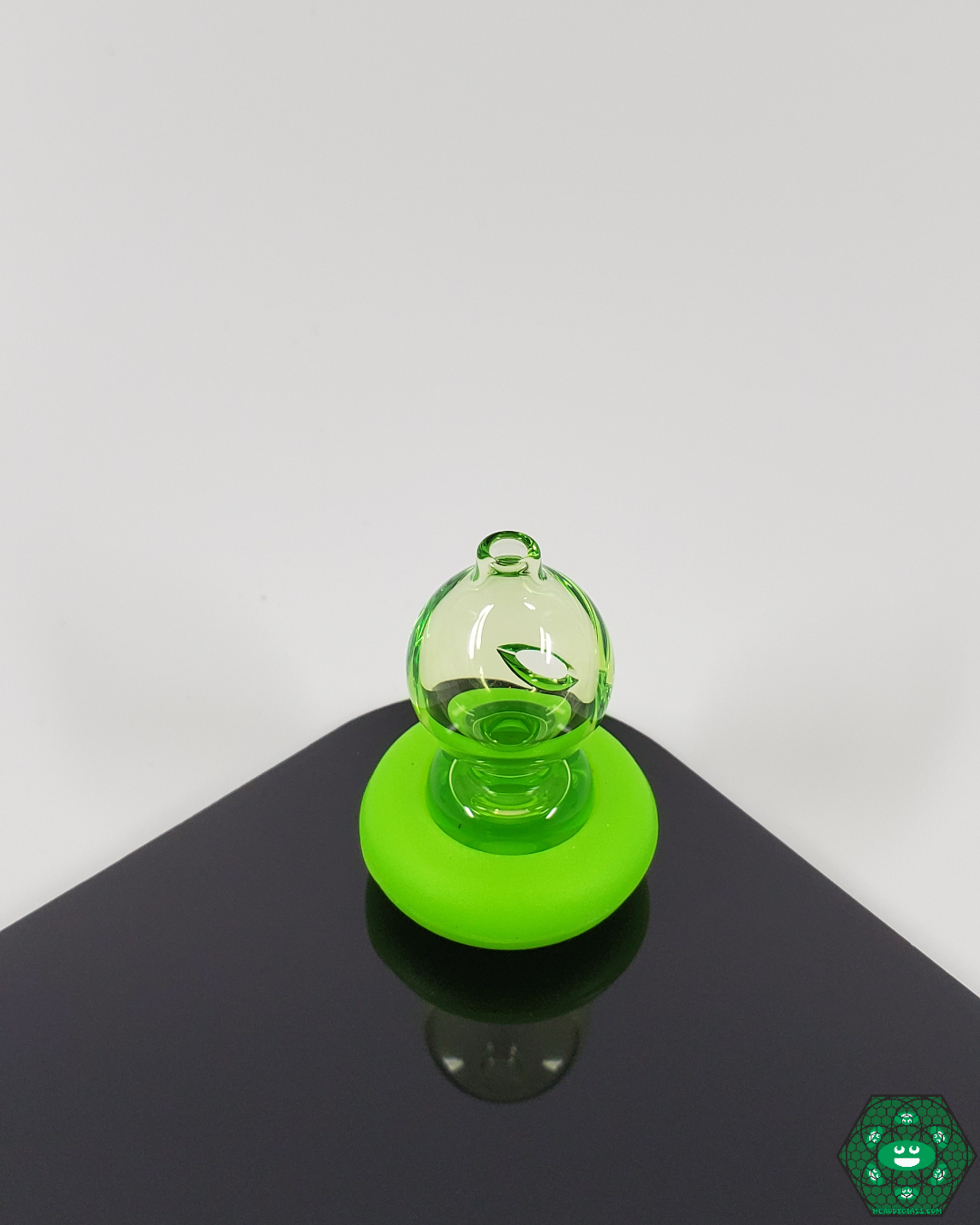  Side view of the Spacewalk Glass Puffco Peak Caps, showcasing their sleek design and durable borosilicate glass construction for a premium dabbing experience.