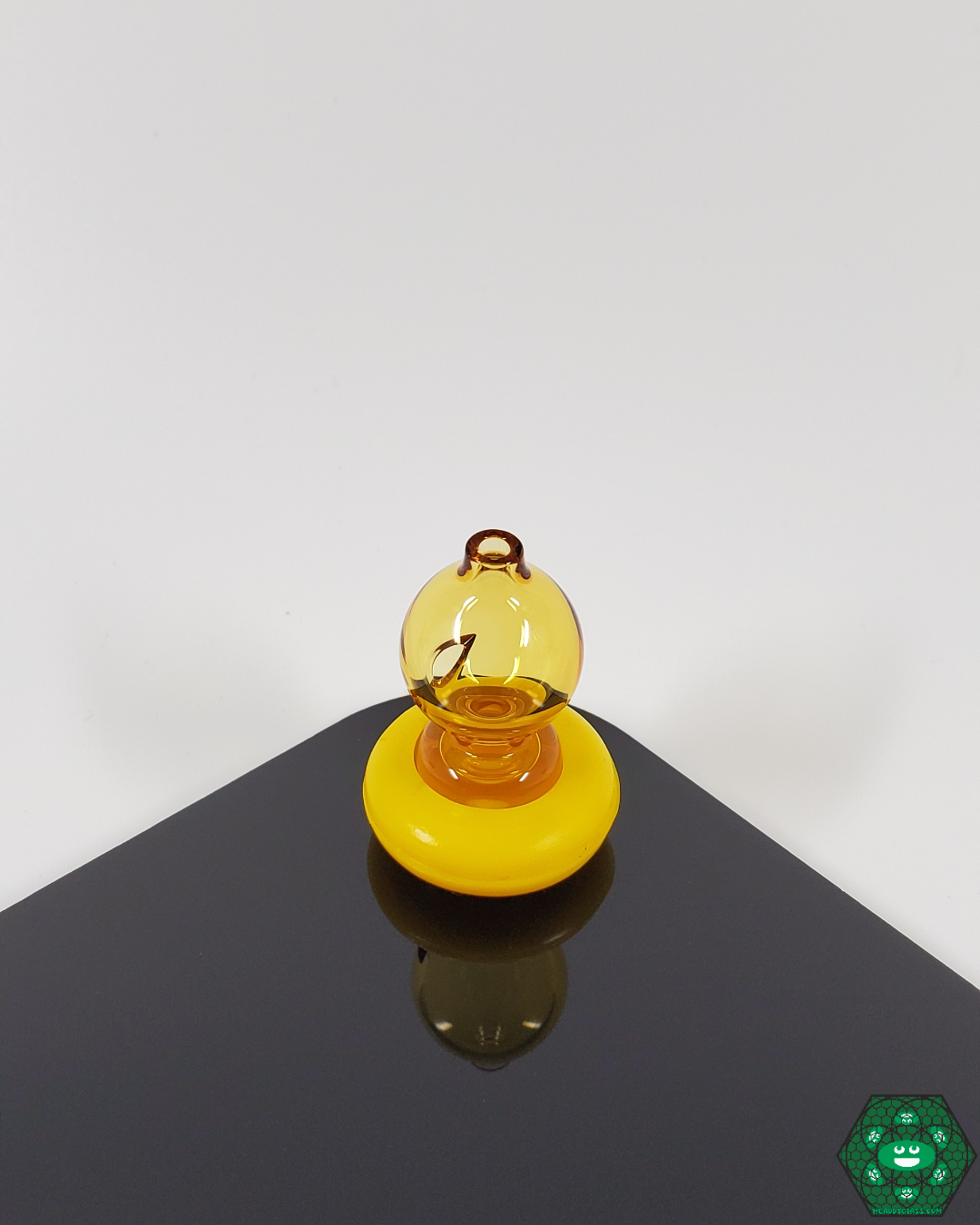  Top view of the Spacewalk Glass Puffco Peak Caps, illustrating the intricate design and high-quality material used to enhance your dabbing experience.