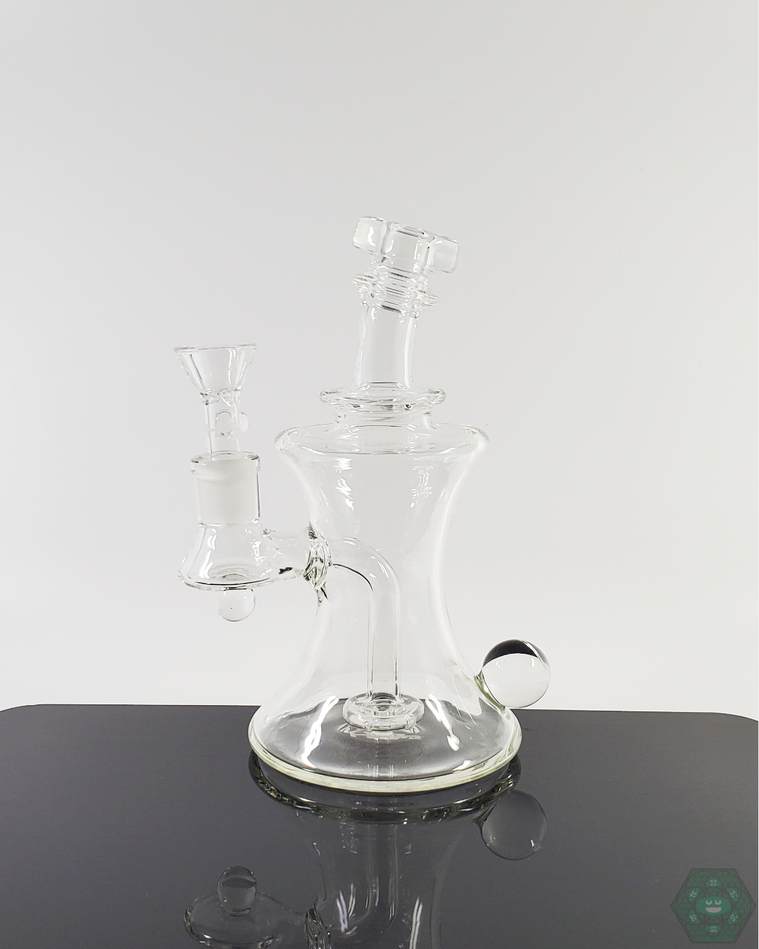 TAG Glass 7.5” Flask-style water pipe featuring premium smooth filtration and a 14mm joint for a refined smoking experience.