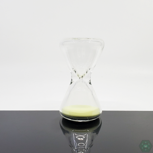  Close-up of the TAG Hour Glass Glow in the Dark 60 Seconds, showcasing its unique glowing design and one-minute timer for accurate session timing.