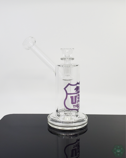 US Tubes 7-inch Mini Bubbler, designed for durability and portability, providing smooth hits in a compact form for easy filtration