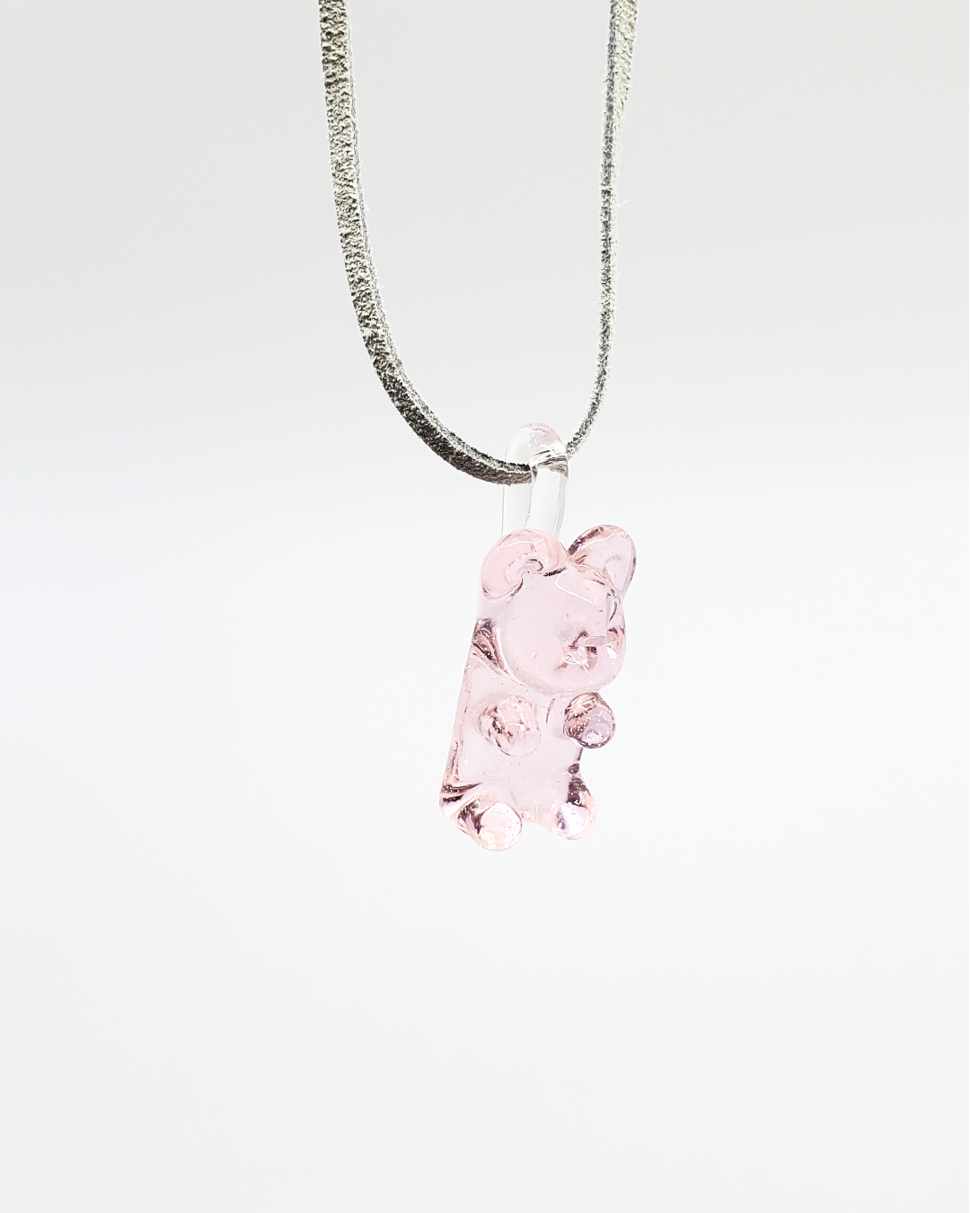 White Chocolate Glass Gummy Bear Pendant, crafted in vibrant pink glass, offering playful art jewelry for enthusiasts and collectors