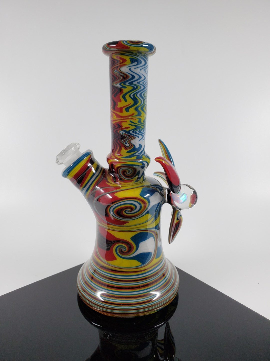  10MM Joint Mini Tube in Rasta Colors by A.H. Glass. This compact and stylish tube is perfect for on-the-go smoking.