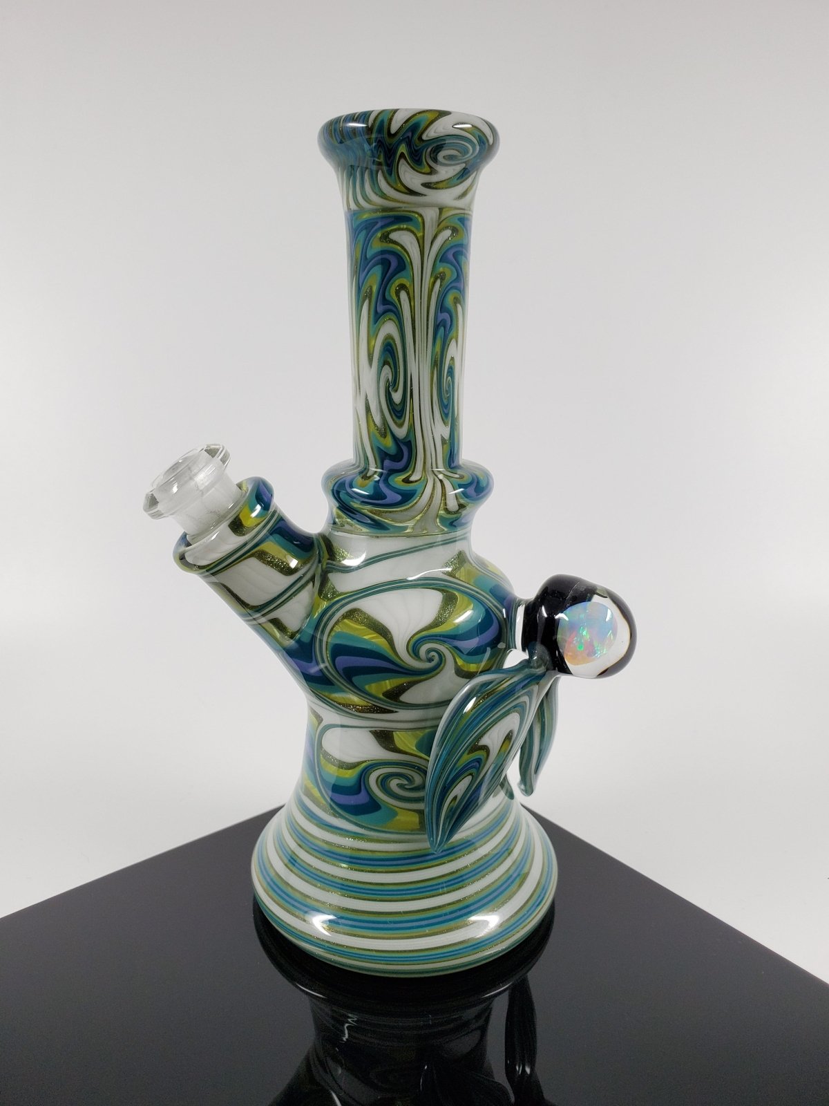 10MM Joint Mini Tube in White and Green by A.H. Glass. This compact and stylish tube is perfect for on-the-go smoking.
