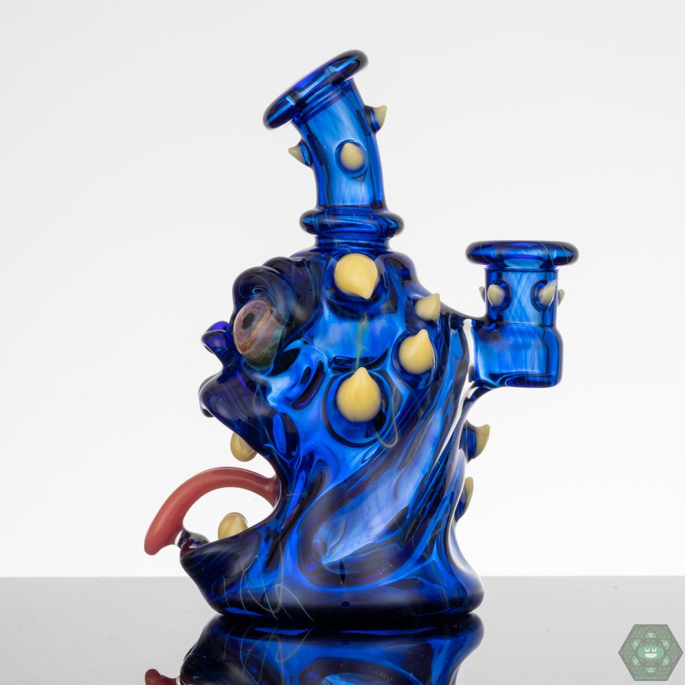 10mm Glass Rig with Gil Perc: This Kaleb Folck rig features a 10mm female joint and a single-hole gil percolator for smooth and efficient filtration.