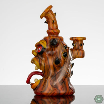 10mm Glass Rig with Gil Perc: This Kaleb Folck rig features a 10mm female joint and a single-hole gil percolator for smooth and efficient filtratioN