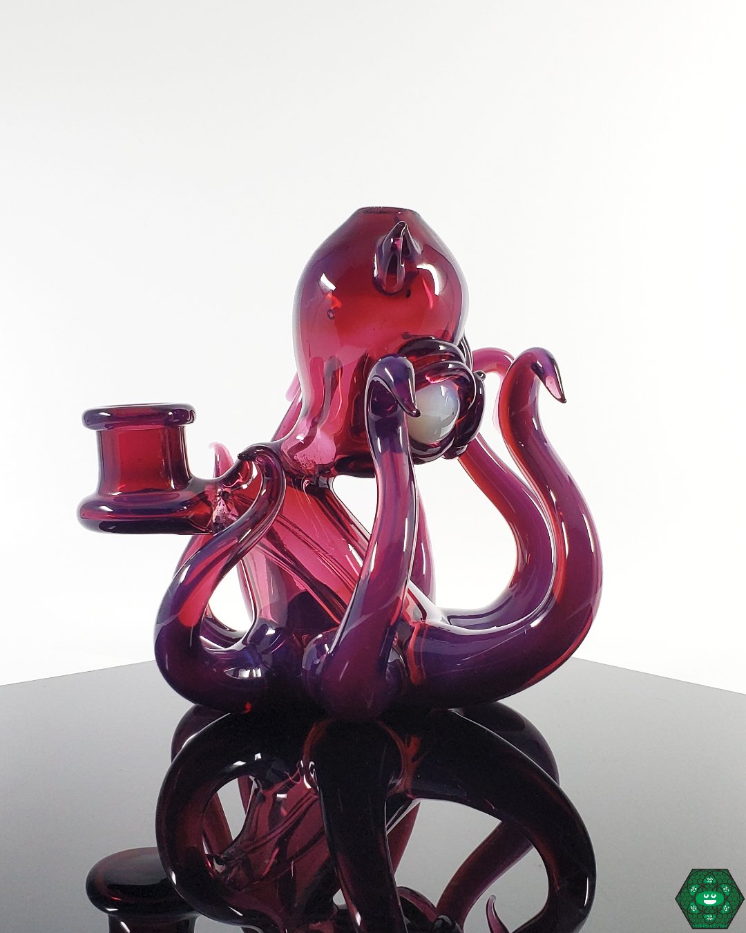 14mm Heady Glass Rig with UV Accents: The Casto Glass Octoblickey #2, showcasing vibrant royal jelly and glopal eyes UV colors and a 3-hole percolator for smooth hits.