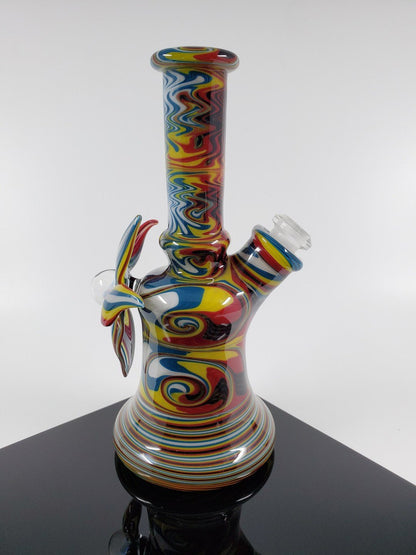 A.H. Glass Rasta Mini Tube | Vibrant Design | Reliable 10MM Joint. Add a touch of style to your setup with this colorful Rasta Mini Tube featuring a durable 10MM joint.