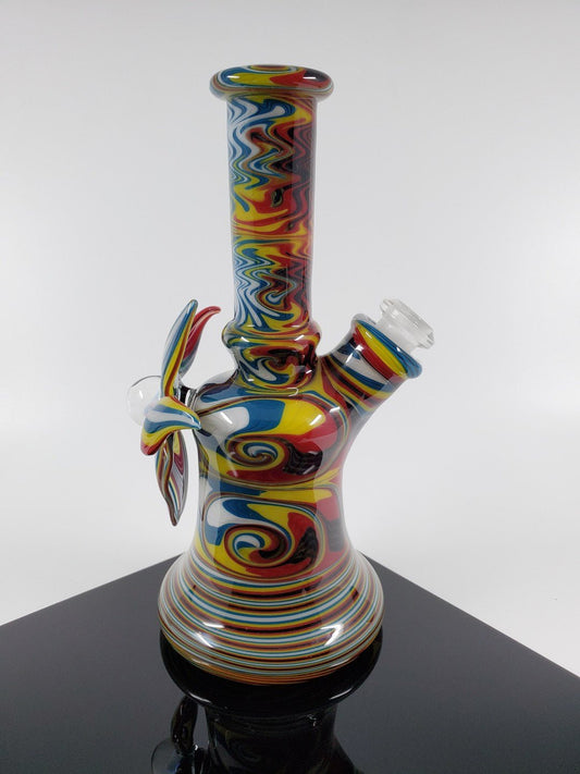 A.H. Glass Rasta Mini Tube | Vibrant Design | Reliable 10MM Joint. Add a touch of style to your setup with this colorful Rasta Mini Tube featuring a durable 10MM joint.