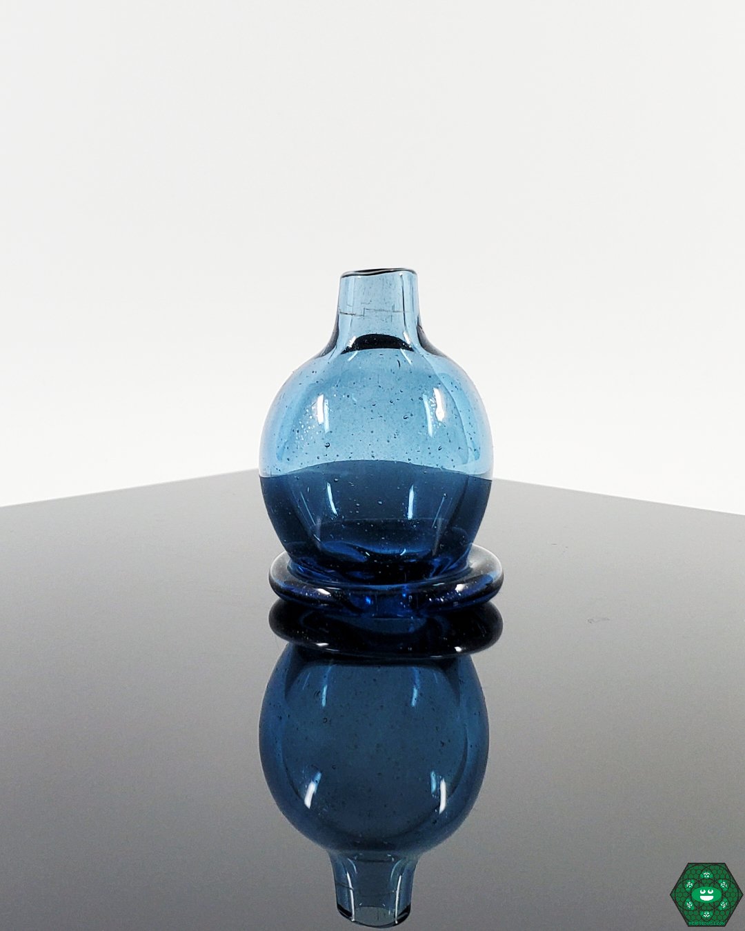 Bigfoot Bubble Cap - 25MM Quartz Nail. Available in Pomegranate, Plasma, Blue Stardust, and Tan. Designed to optimize airflow and vapor quality.