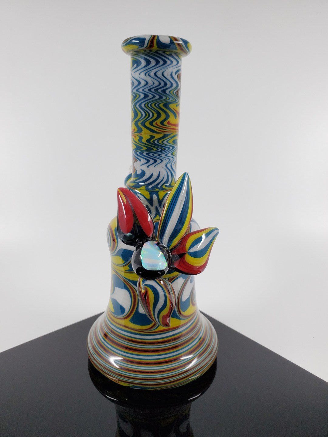 Colorful Rasta Mini Tube from A.H. Glass | 10MM Joint. Enjoy a smooth smoke with this vibrant and reliable mini tube. Perfect for everyday use.