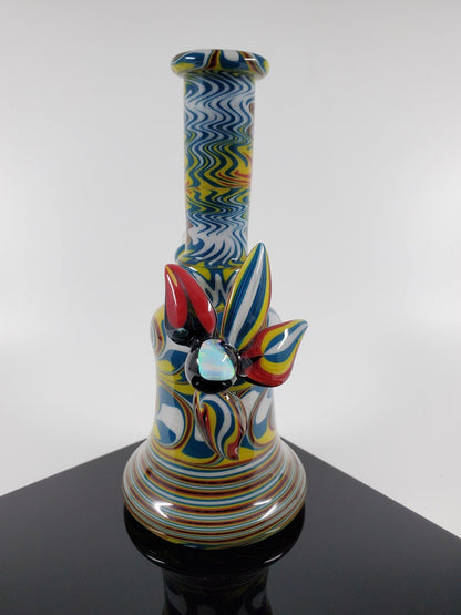 Colorful Rasta Mini Tube from A.H. Glass | 10MM Joint. Enjoy a smooth smoke with this vibrant and reliable mini tube. Perfect for everyday use.