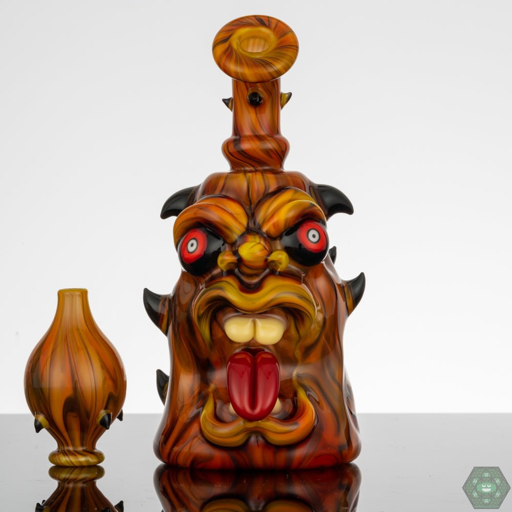 Kaleb Folck GPPR Open Mouth #336, a UV reactive glass rig with detailed craftsmanship, combining functional design with UV-reactive glass accents, featuring a 10mm female joint and single-hole gil perc, an open mouth design with a matching bubble cap for enhanced aesthetic.


