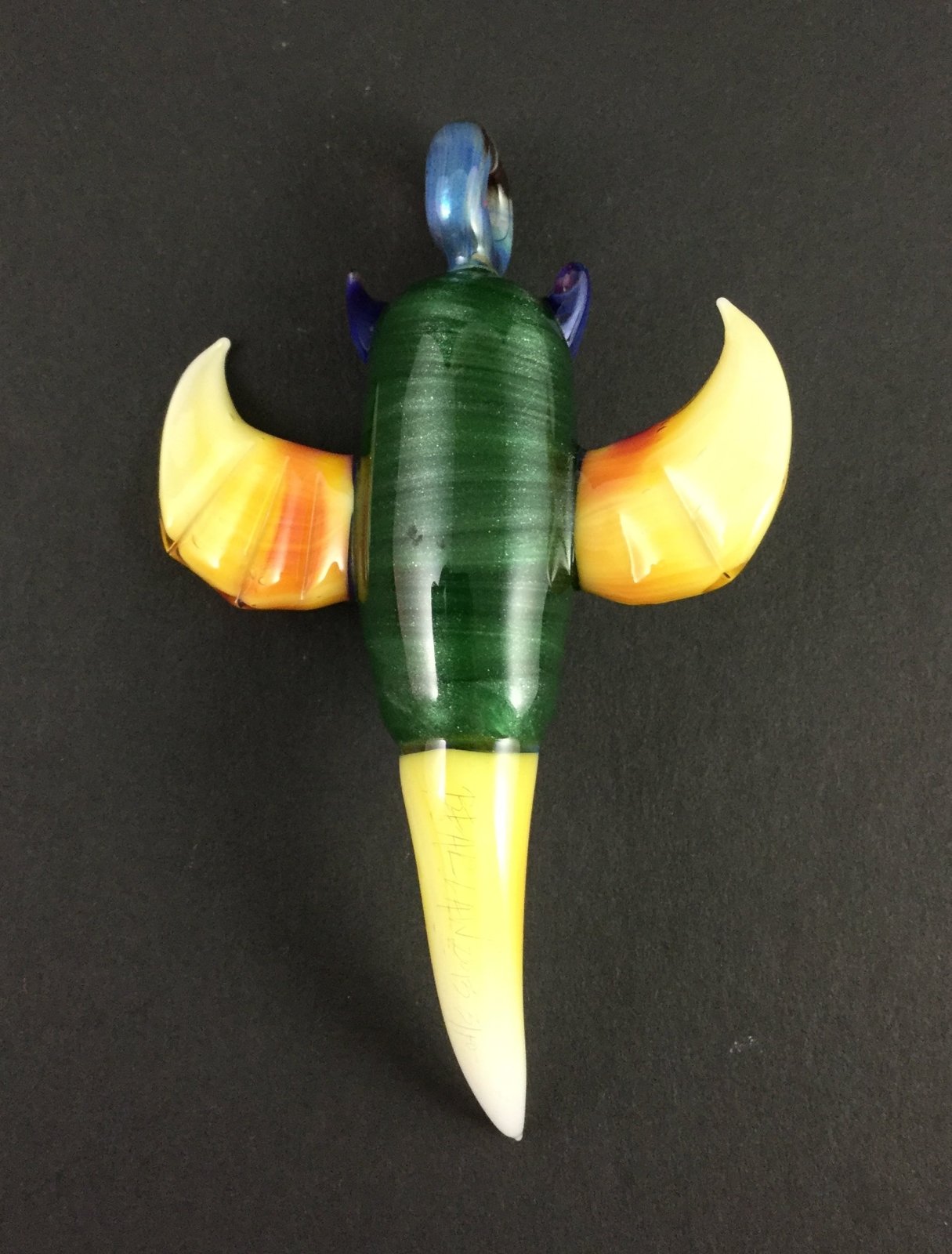 Handcrafted Glass Owl Pendant - Bearclaw. This unique piece of jewelry features intricate glasswork and a detailed owl design.