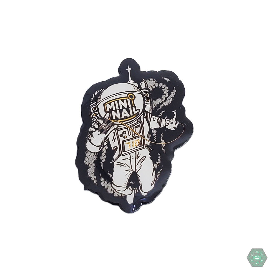 This Mini Nail Spaceman Hat Pin is a fun and stylish enamel pin featuring a unique astronaut design. It's perfect for adding a touch of personality to your favorite hat, jacket, or bag.