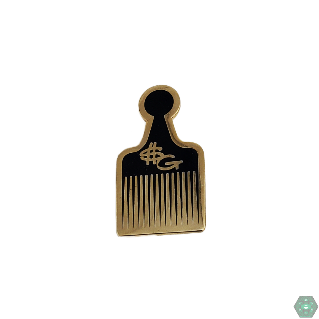 The Slum Gold Hair Pick Comb Pin is an iconic and stylish enamel pin that adds a touch of luxury to any collection. Its unique design and durable enamel make it a standout piece for style enthusiasts.