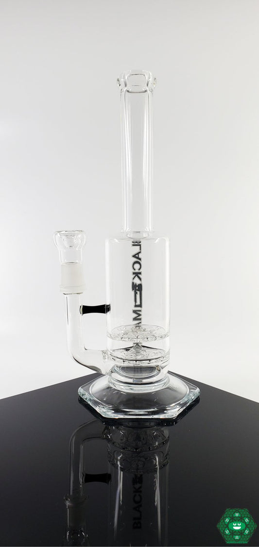  Small Can Double Disc Rig - Black Market Glass. 11.25 inches, clear glass rig with a double disc percolator for smooth hits. 18MM male joint and matching slider. Built for both functionality and aesthetics.