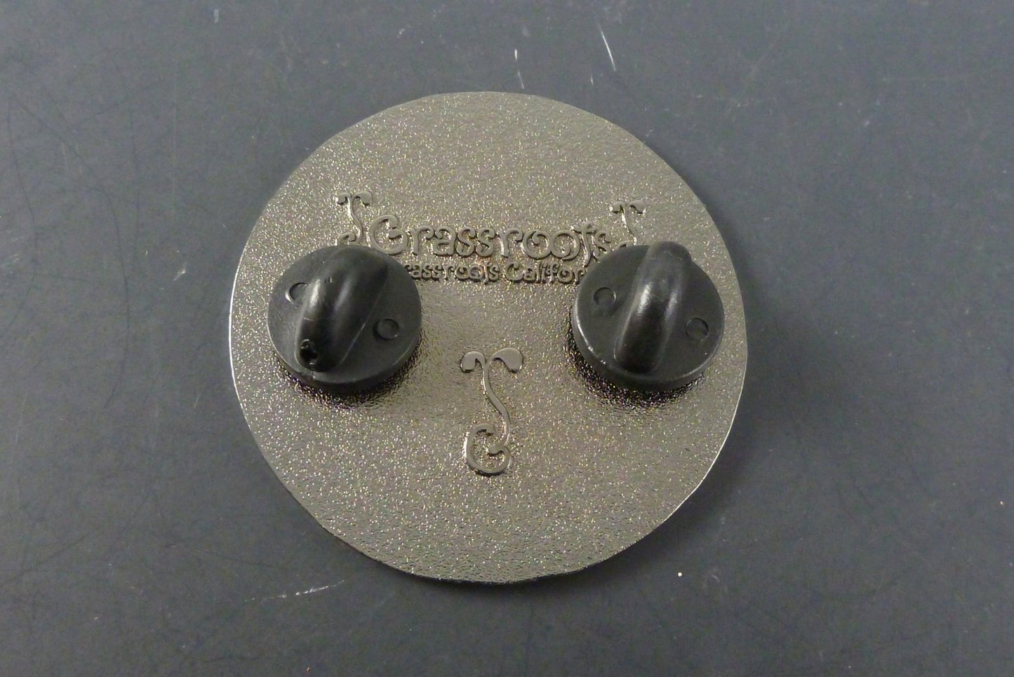 Vintage Coin Hat Pin with Antique Finish. This vintage-inspired hat pin features a coin design, adding a touch of old-world charm to your accessories.