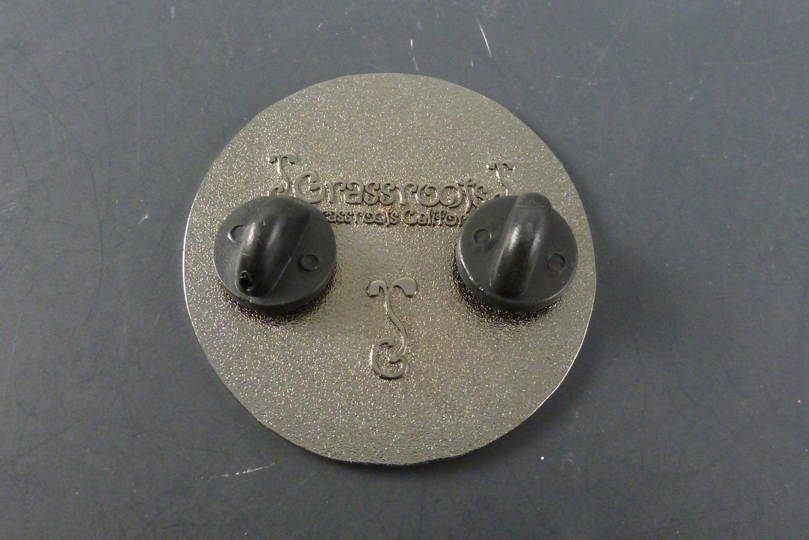 Vintage Coin Hat Pin with Antique Finish. This vintage-inspired hat pin features a coin design, adding a touch of old-world charm to your accessories.