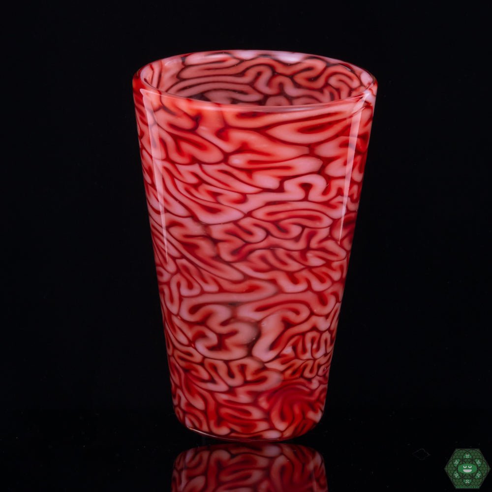 Red Brain Tech Pint Glass by Algae Glass, a handcrafted and distinctive piece of glassware featuring rich red patterns resembling brain textures, combining functionality with artistic flair, ideal for those who appreciate unique glasswork.