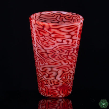 Red Brain Tech Pint Glass by Algae Glass, a handcrafted and distinctive piece of glassware featuring rich red patterns resembling brain textures, combining functionality with artistic flair, ideal for those who appreciate unique glasswork.