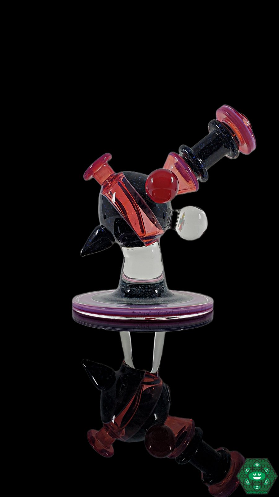 Cajun Glass Telemagenta Crushed Opal Heliosphere, a luxurious glass piece featuring crushed opal accents, a 10mm female joint for versatility, and UV-reactive glass for stunning visual appeal, perfect for collectors.