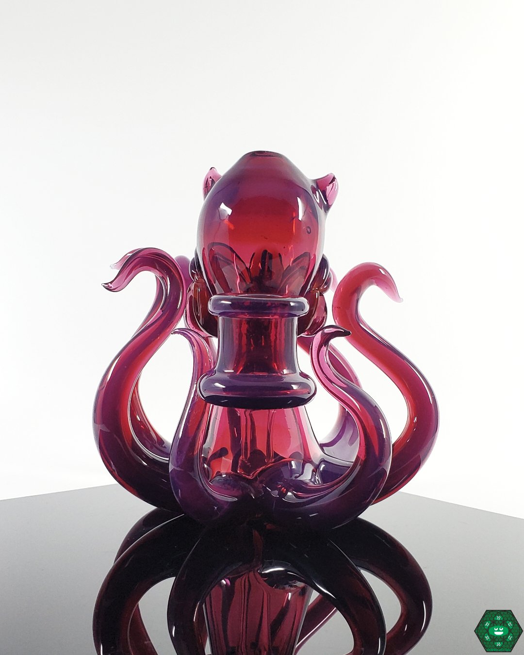 Casto Glass Octoblickey #2: Close-up showcasing the stunning royal jelly and glopal eyes UV colors and intricate details of this 14mm heady glass rig.