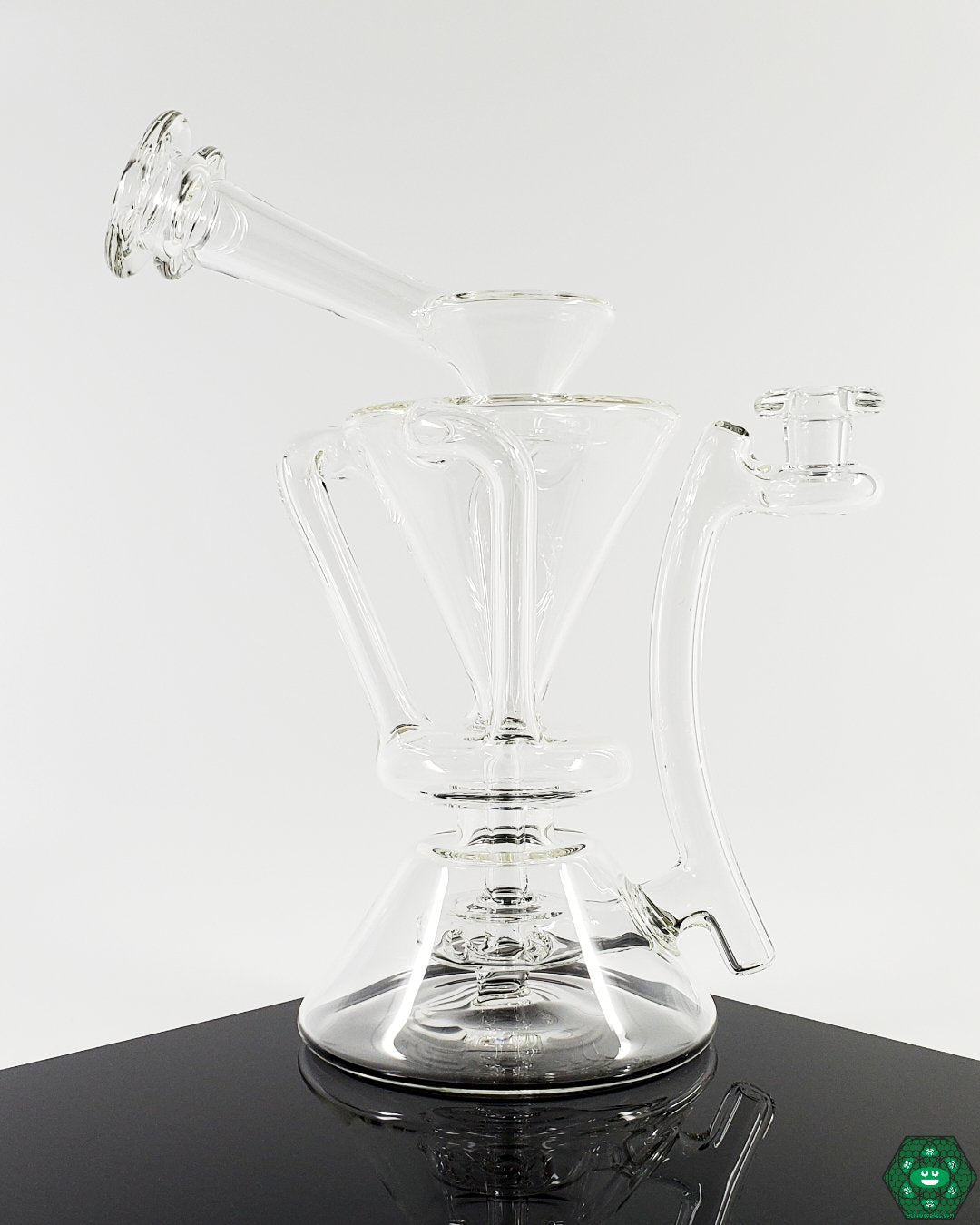 Clear Internal Recycler #3: The McGrew Glass Clear Internal Recycler, combining elegant design with smooth, filtered hits through its intricate internal recycling system, ideal for discerning glassware collectors.


