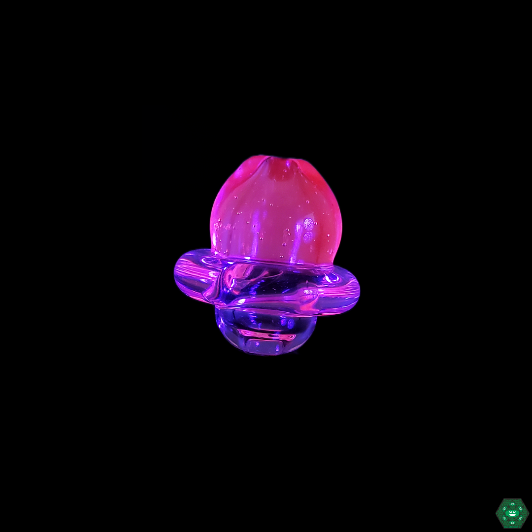 Clear Peak Caps by Hoyer Glass attached to a Puffco device, showcasing their perfect fit and enhanced vapor production for a premium dabbing experience.