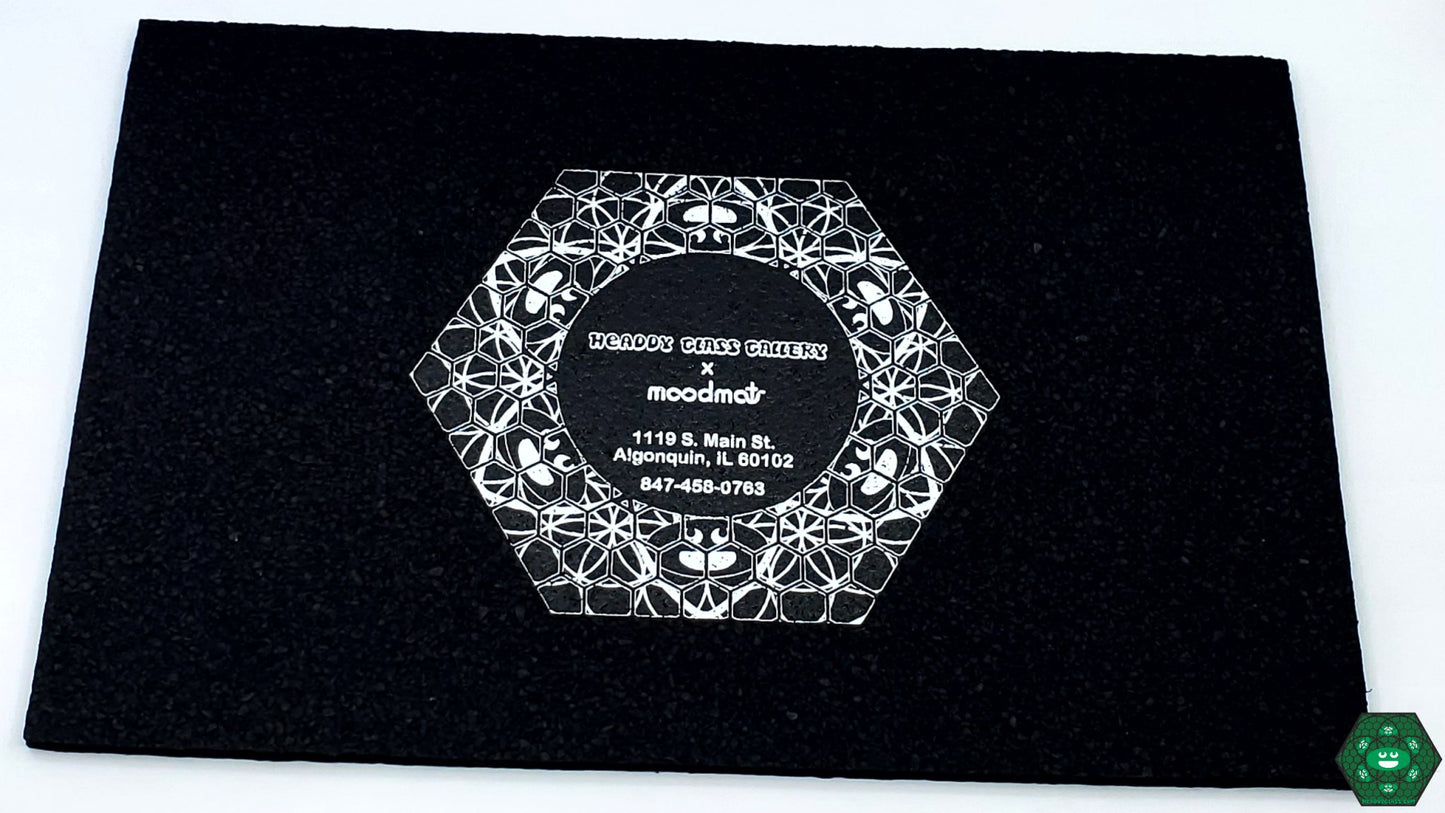 Compact Dab Mat: The Headdy Sesh Mat, a durable and heat-resistant mat perfect for small rigs, providing a non-slip surface to protect your glass and enhance your sesh area with style.