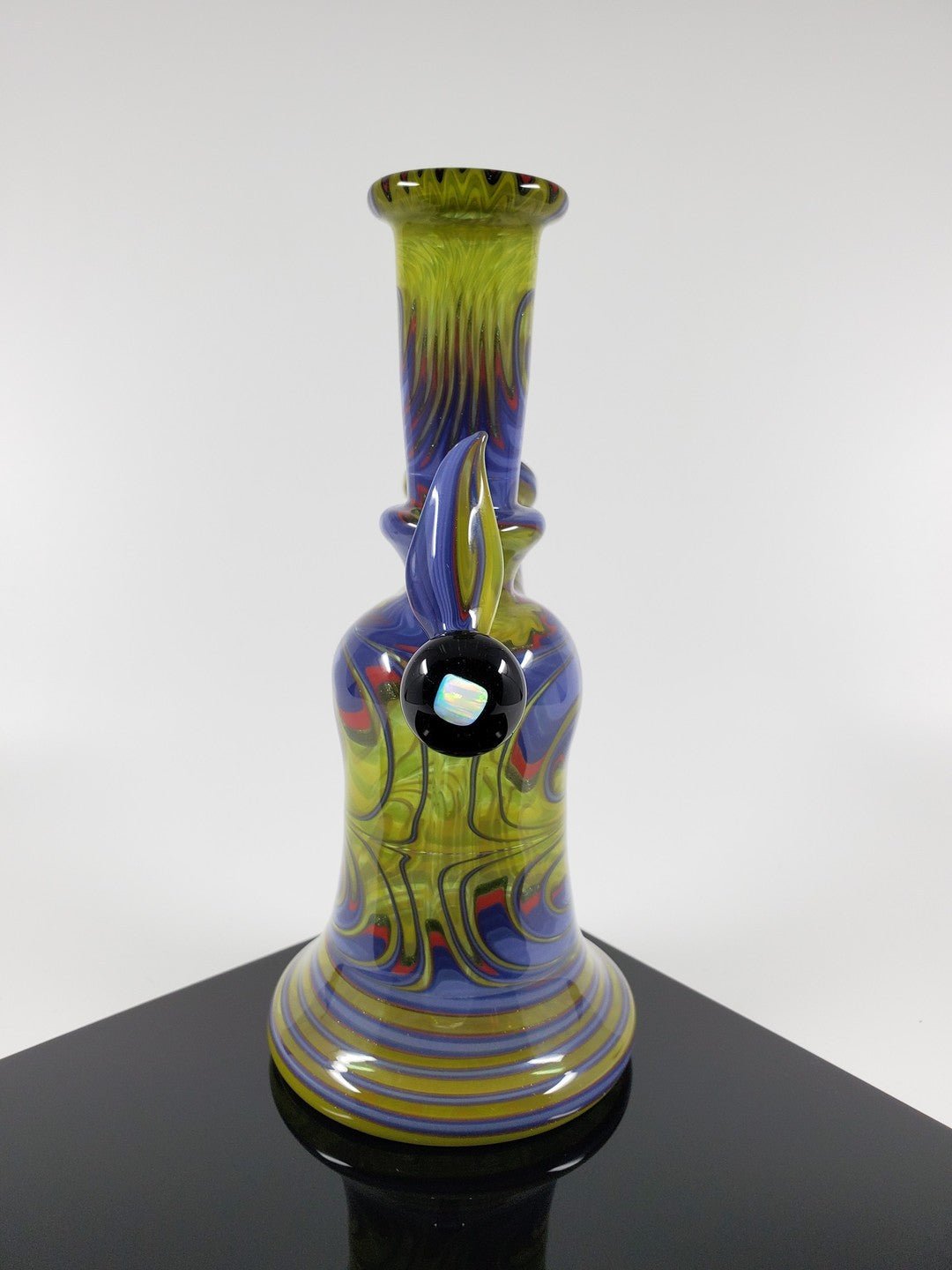 Compact and stylish Green Red Mini Tube by A.H. Glass featuring vibrant colors.
