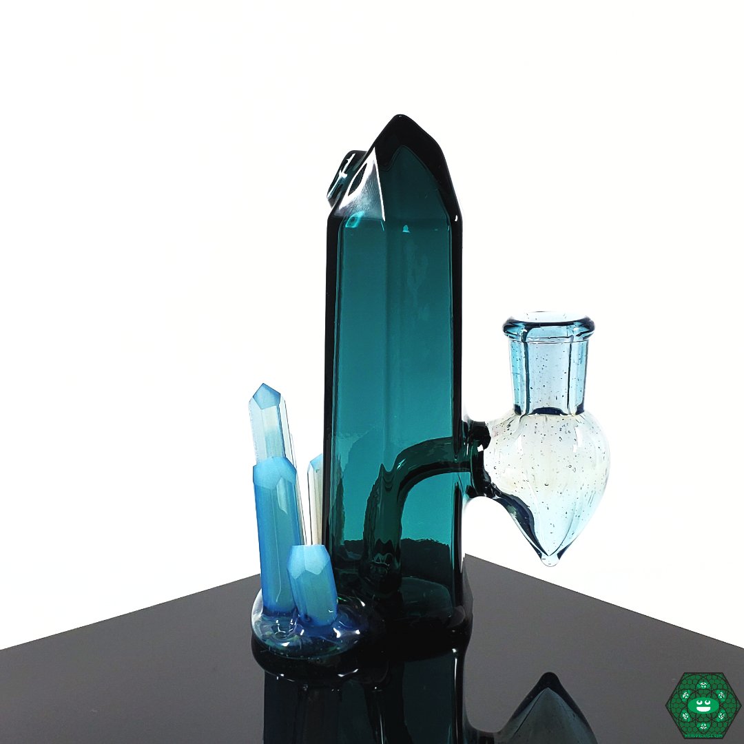 Digger Glass Lil Cutie Crystal Cluster Rig – 5.25” tall with Indicolite Teal crystal cluster design, featuring a 2-hole perc and 10mm male 90-degree joint for smooth filtration.