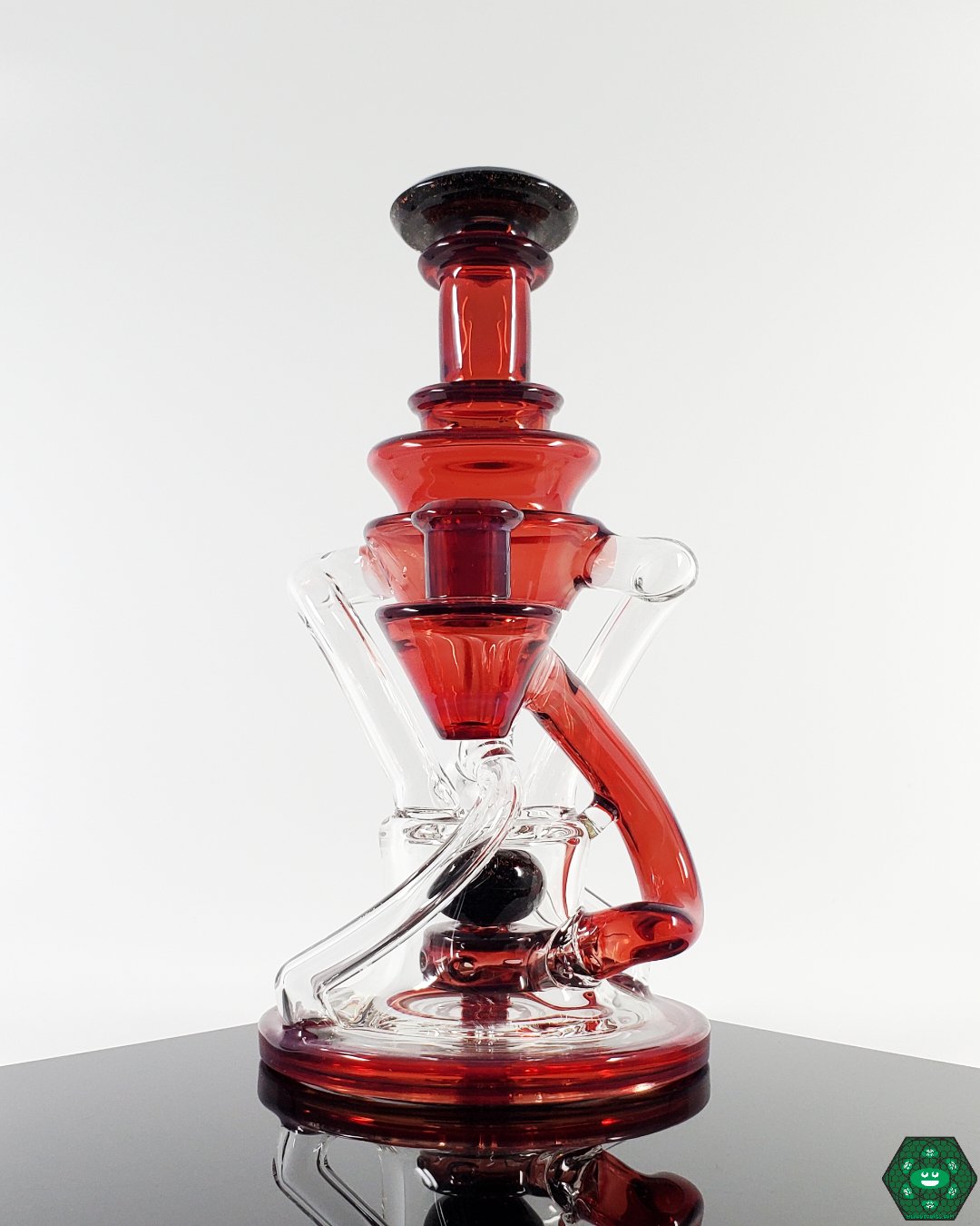  Dual Uptake with 4-Hole Perc Recycler: The Cerio Glass Phoenix V2, designed for top-tier performance and smooth hits with its advanced filtration system, a must-have for collectors.


