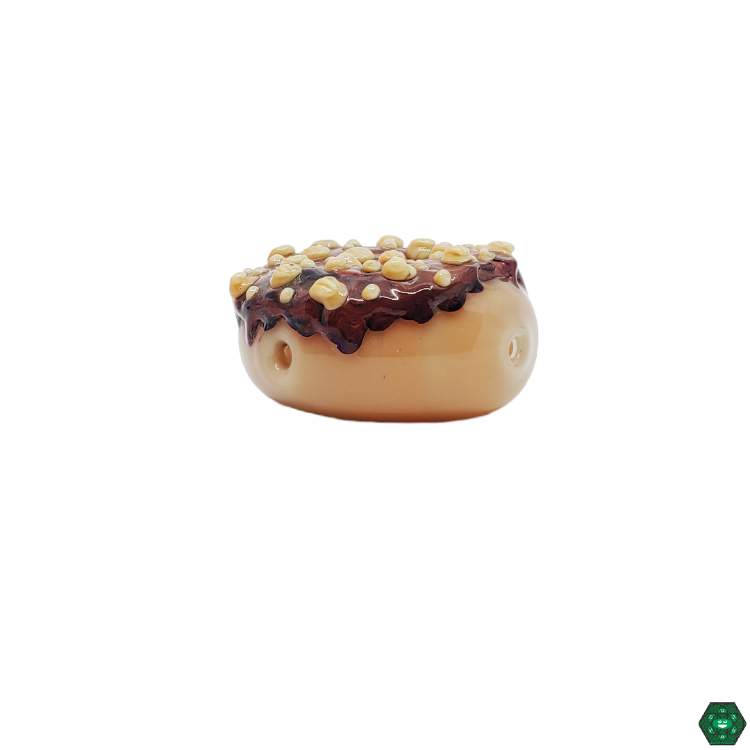 Close-up of the Empire Glassworks Chocolate Donut Spoon, showcasing the detailed chocolate donut design and high-quality craftsmanship for a unique and enjoyable smoking experience.