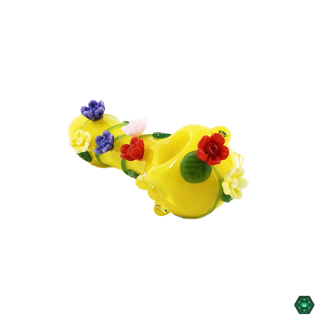  Close-up of the Empire Glassworks Sunshine Garden Spoon, showcasing the intricate floral-inspired design and vibrant colors, crafted for floral enthusiasts and collectors.