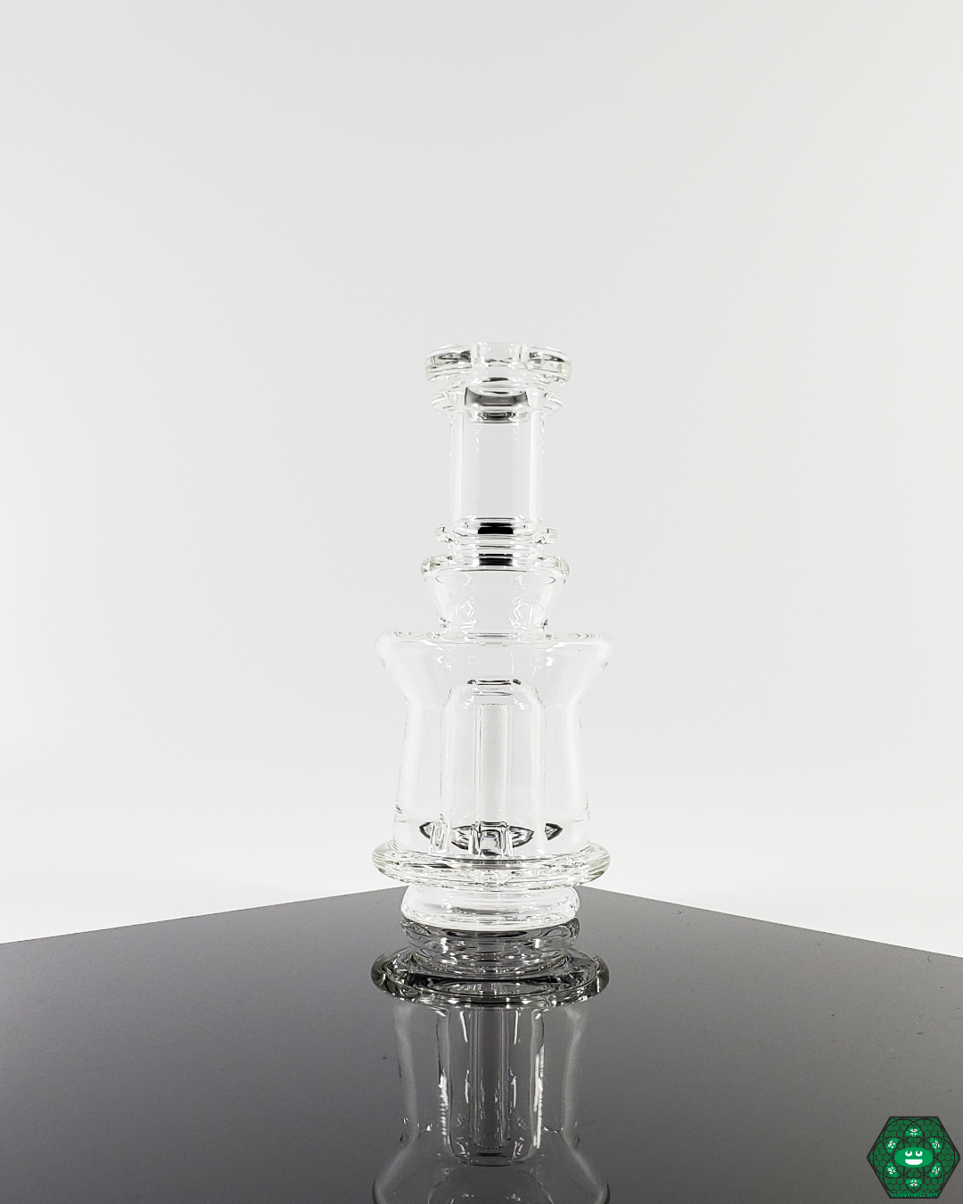  Enhanced Puffco Attachments: Ery Glass upgrades your Puffco experience with custom glass attachments, featuring a one-hole perc for improved function and available in a 4.25"-5" height and 1.75" diameter.