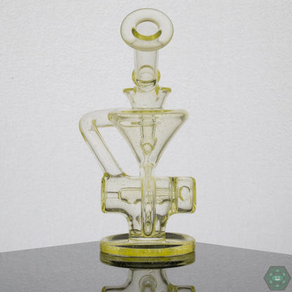 Eric Law Compact Recycler, a 6.5-inch glass rig that includes a sticker and business card for authenticity.