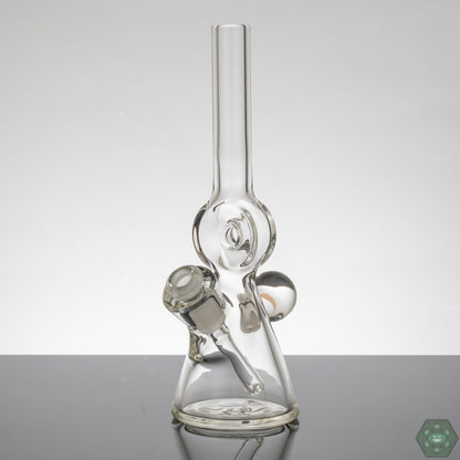 Gemini Glass Clear Donut Tube #2, a compact tube with opal inlay and 3-hole perc, featuring a 10mm female joint and a 10mm to 14mm removable downstem, standing at 7.5” tall, perfect for easy handling, includes a free sticker and business card.