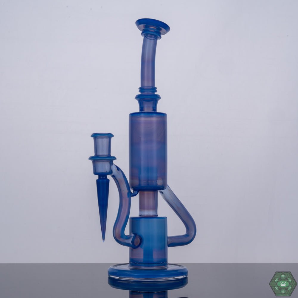 The Glass Carpenter Sonic Bubble Dumper, a 14mm recycler rig featuring a sonic-inspired bubble perc for enhanced filtration, combining functionality with futuristic design, a handcrafted piece designed to elevate your sessions, both visually and technically impressive.


