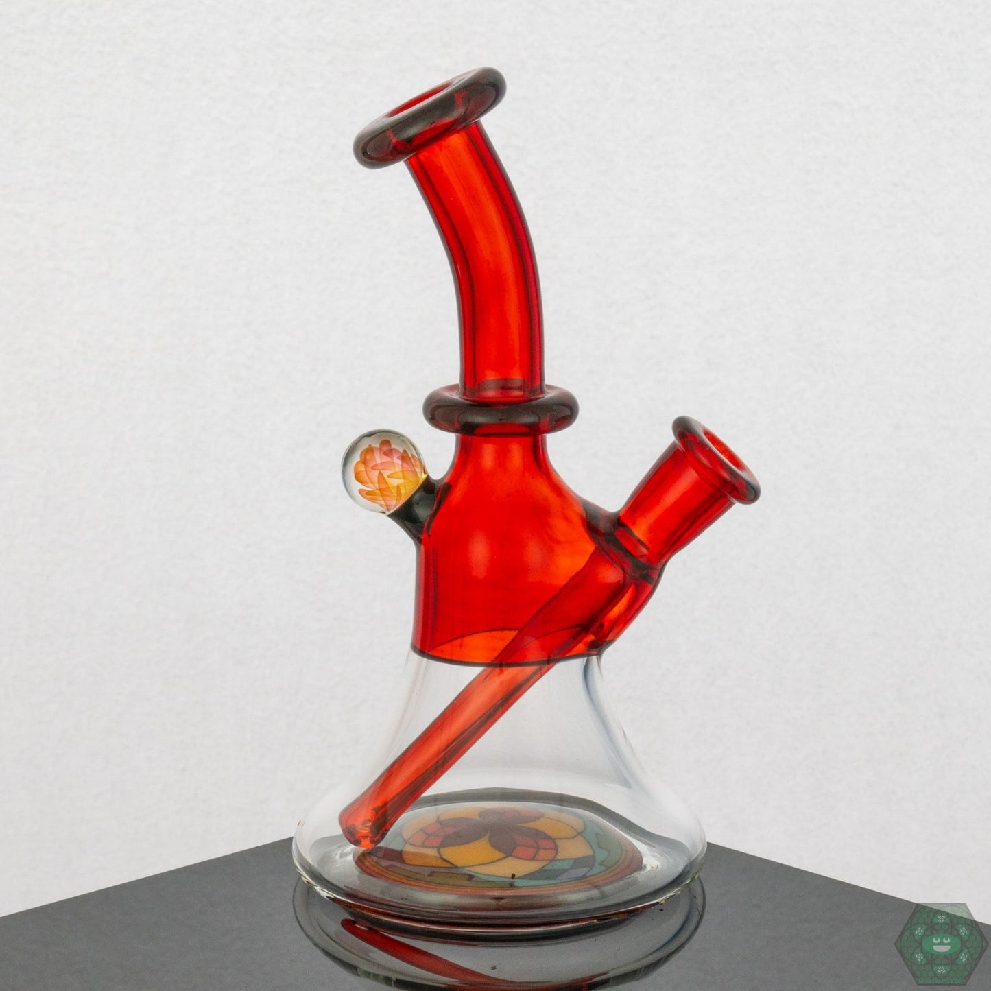 Handcrafted Brian Jacobson Mini Glass Tube, 8 inches tall, featuring a vibrant pomegranate color design.