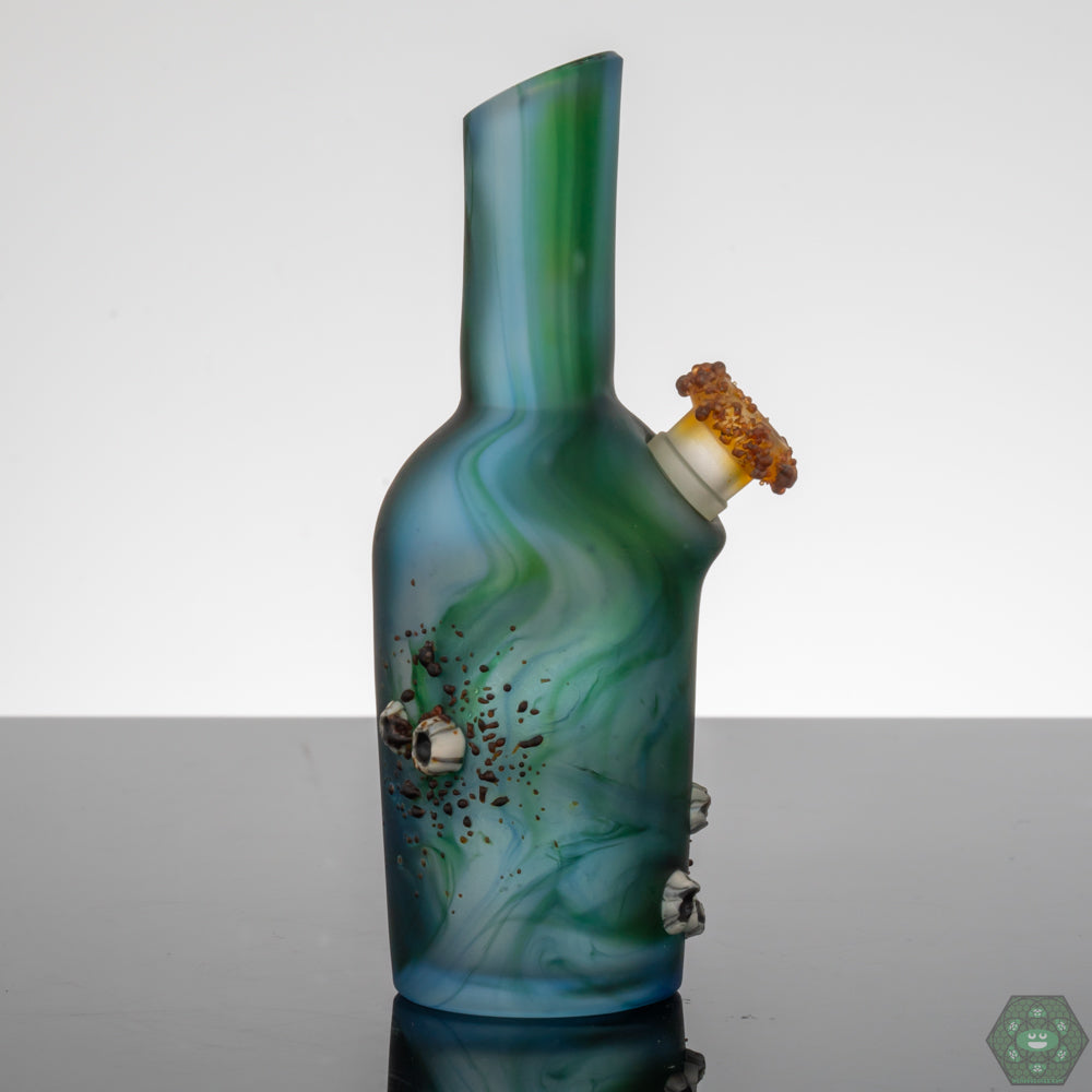 Handcrafted Glass Art with Barnacle Details: The Whitney Harmon Barnacle Chubby Bubby showcases intricate barnacle detailing, highlighting the artist's skill and creating a unique textured aesthetic.