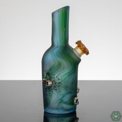 Handcrafted Glass Art with Barnacle Details: The Whitney Harmon Barnacle Chubby Bubby showcases intricate barnacle detailing, highlighting the artist's skill and creating a unique textured aesthetic.