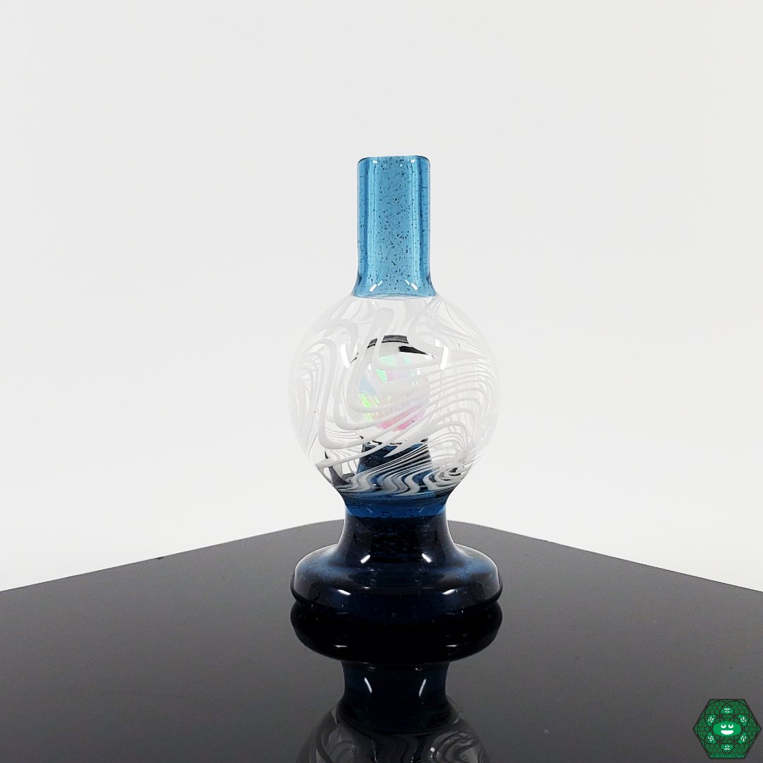  Handcrafted Glass Bubble Cap: The Soup Glass Wig-Wag Bubble Cap is an artisanal creation, featuring intricate wig-wag work and an encased opal, perfect for dabbing enthusiasts.